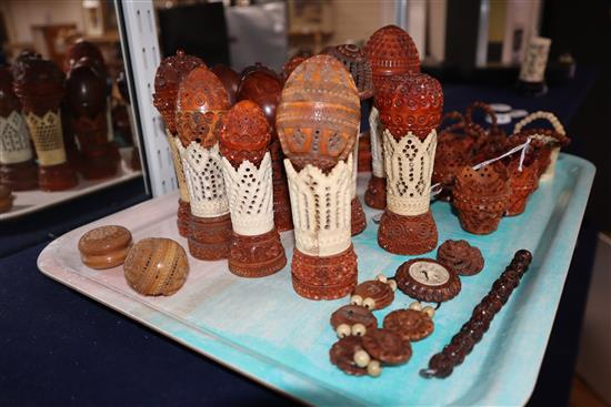 A group of 19th century coquilla nut and vegetable ivory engine turned containers, stands, miniature baskets, napkin rings and jeweller